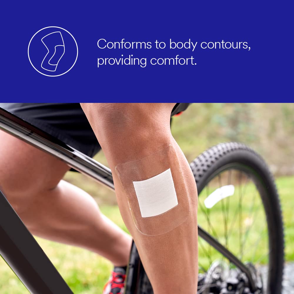 Tegaderm transparent adhesive pad applied to a cyclist's knee, shown conforming to skin contour near a bicycle