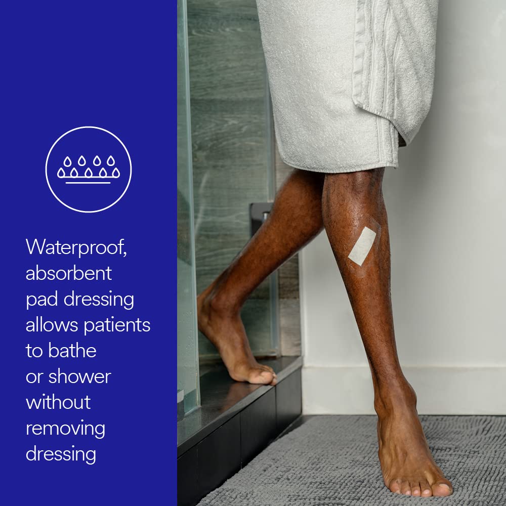 Waterproof pad wound dressing applied to a person's lower leg as they step into a shower