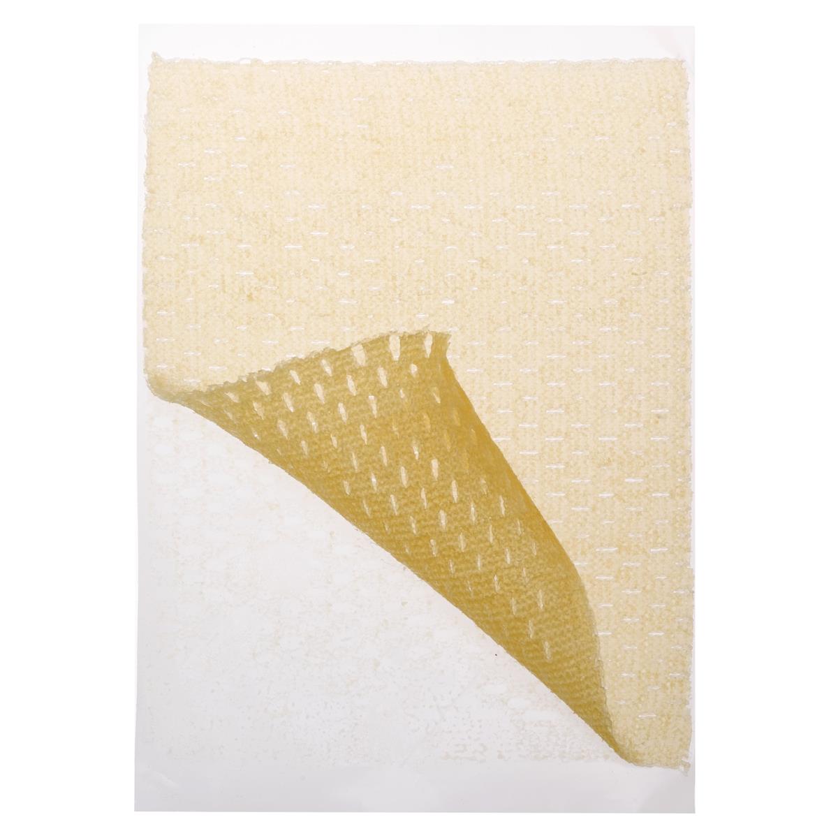 Honey wound dressing with corner folded back showing golden adhesive layer and white absorbent pad on white background