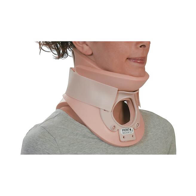 Cervical collar with tracheotomy opening worn by a person, rigid beige two-piece design with front label, medium size