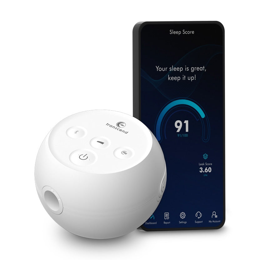 Transcend Micro Auto CPAP machine in white spherical design beside a smartphone displaying a sleep score app