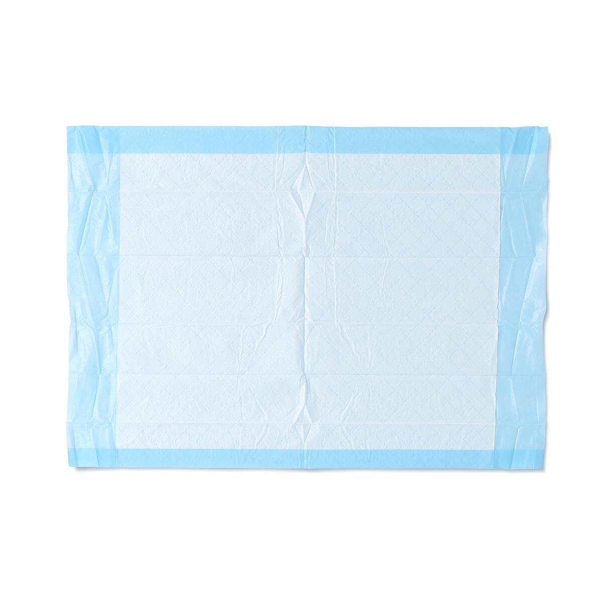 Disposable underpad laid flat, showing white absorbent center with light blue waterproof border edges