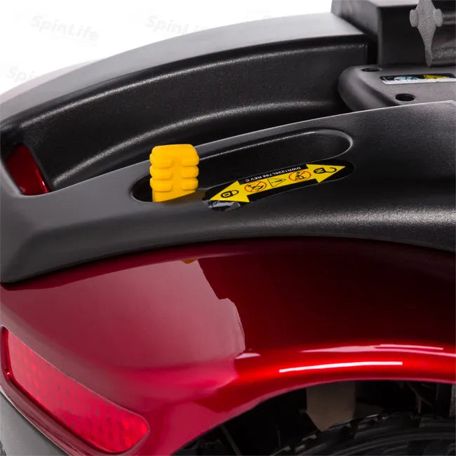Power scooter rear section showing yellow disengagement lever on black battery housing above red fender with taillight