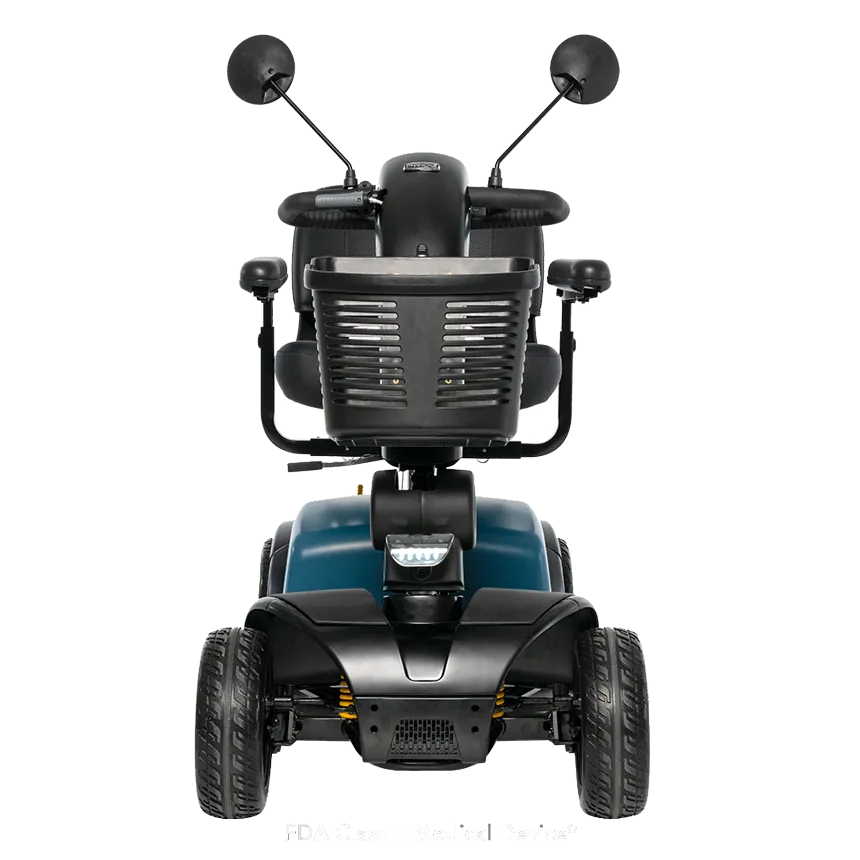 Power mobility scooter with four wheels, teal body, black seat, dual rearview mirrors, and front LED light, viewed from the