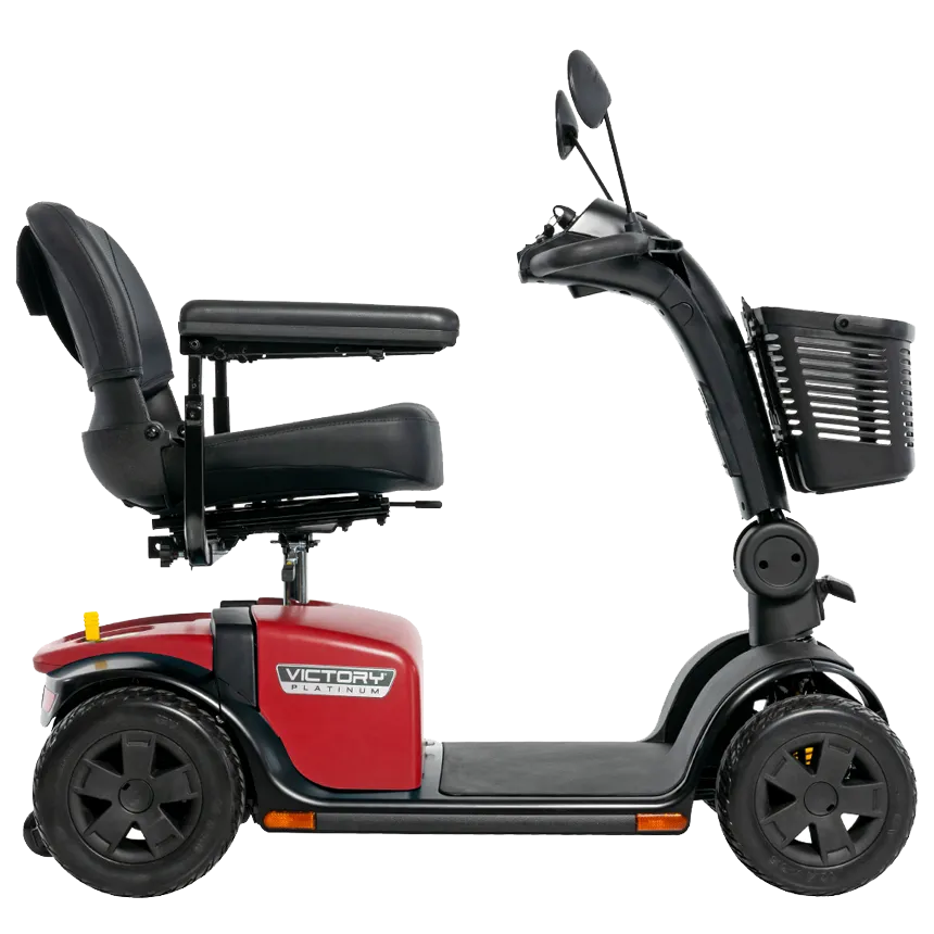 Pride Victory Platinum 4-wheel mobility scooter in red with black captain's seat, armrests, front basket, and mirrors, shown