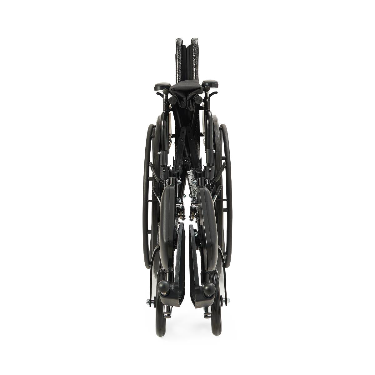 Wheelchair folded flat, front view, showing black frame, large rear wheels, folded footrests, and push handles against white