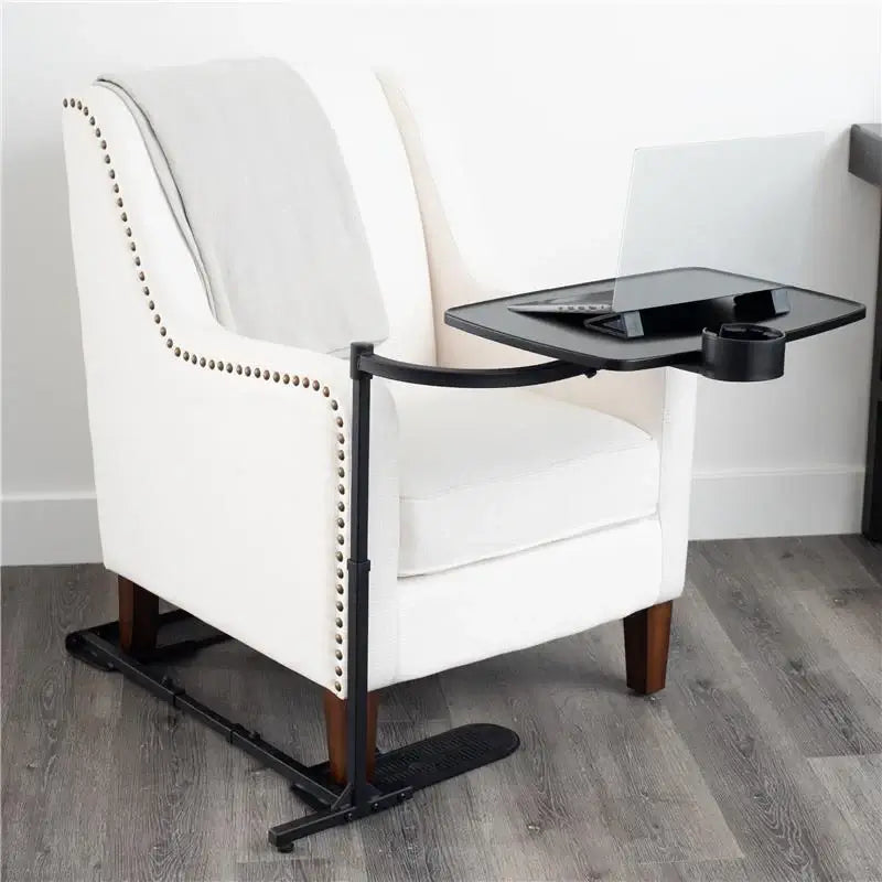 Swivel chair tray with black metal frame, cup holder, and pivot surface attached to a white upholstered armchair