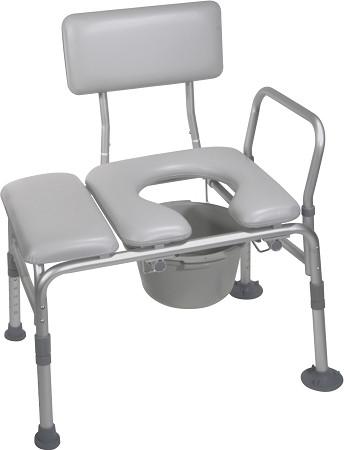 Padded seat transfer bench with commode opening, cutout seat, removable bucket, armrail, and adjustable legs on white