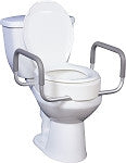 Toilet seat riser with removable gray padded armrests installed on a white toilet