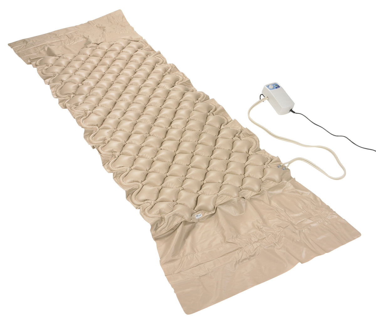 Alternating pressure pad system with tan bubble-cell surface laid flat, connected by tubing to a small electric pump motor