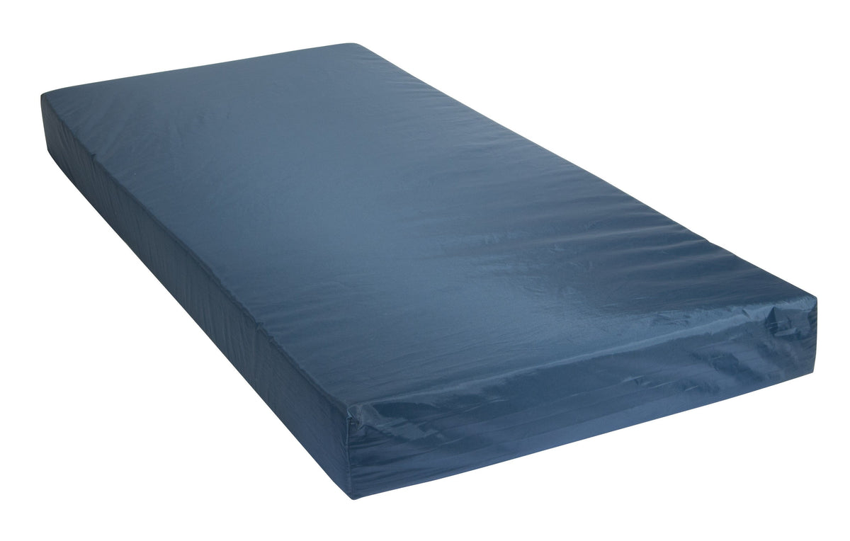 Therapeutic foam mattress with blue vinyl cover, shown at an angle on white background