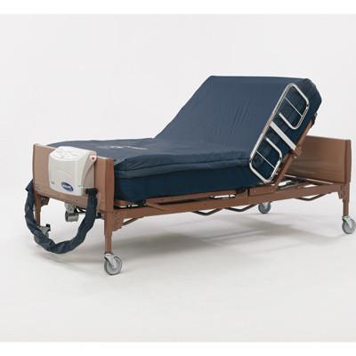 Alternating pressure mattress system with electric pump on a full-length hospital bed with raised head section and side rails