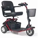 Red 3-wheel mobility scooter with padded seat, armrests, tiller handlebar, and front wire basket