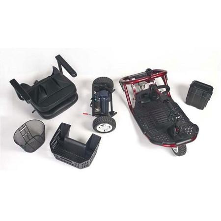 Mobility scooter disassembled into separate components including seat, frame, wheels, battery, and basket on white background
