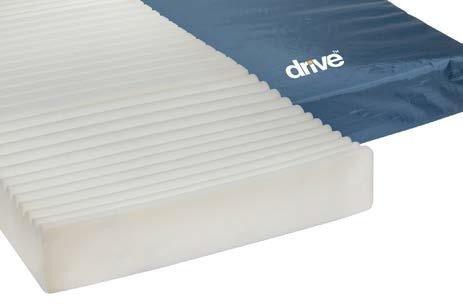 Foam mattress with white convoluted surface and blue vinyl cover, partially unzipped to show interior construction