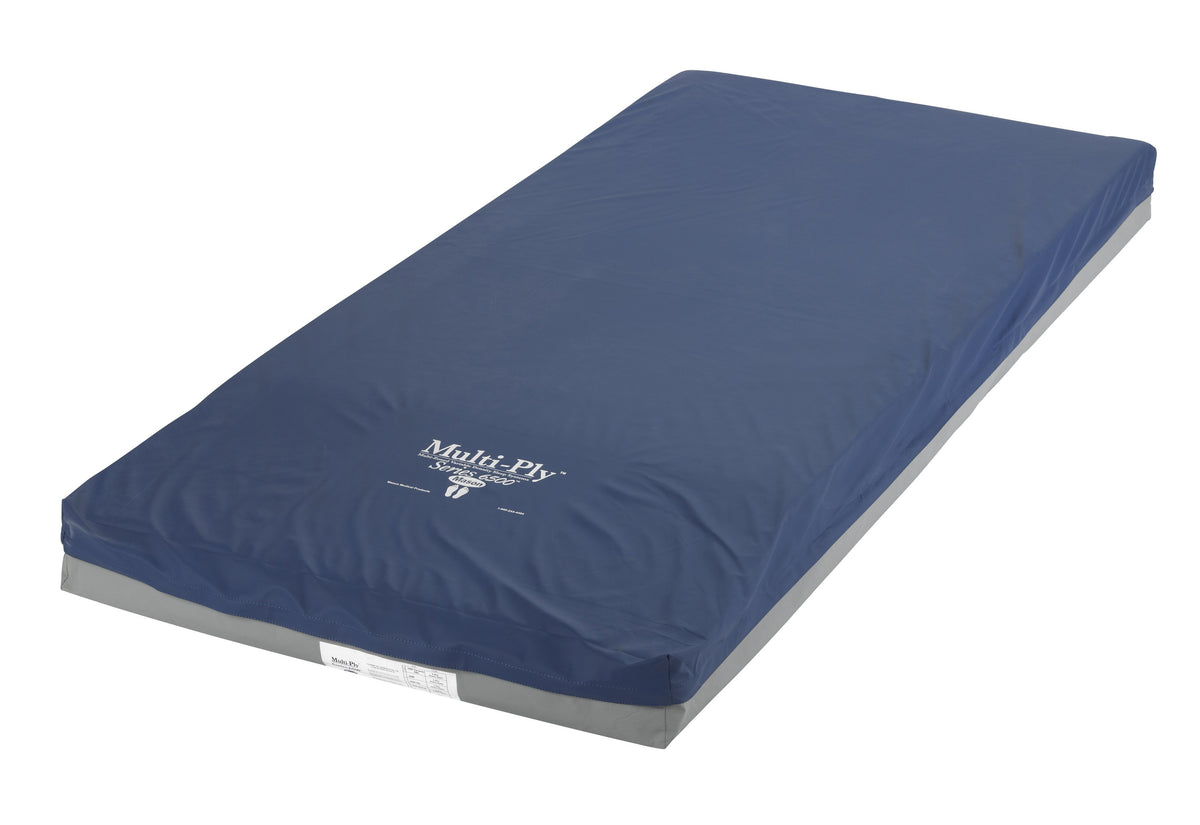 Multi-Ply 6500 foam mattress with navy blue cover and gray base, shown at an angle on white background