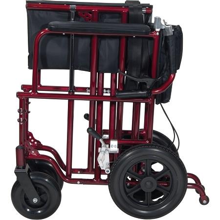 Bariatric transport chair in red with black upholstery, large rear wheels, hand brakes, and side storage bag, shown folded