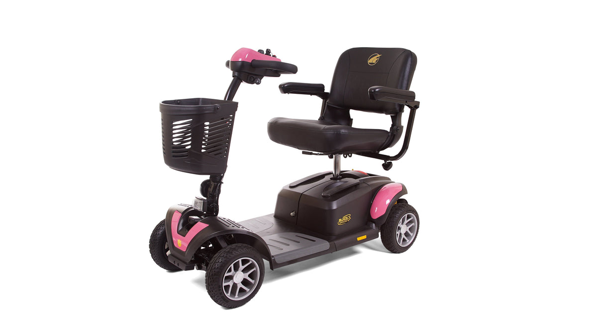 Four-wheel mobility scooter in pink and black with padded seat, armrests, tiller steering, and front basket