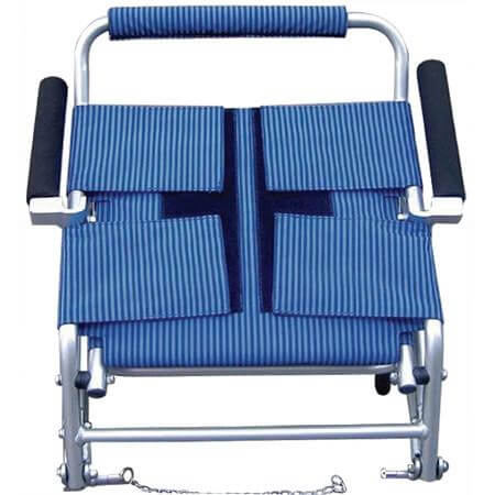Folding transport chair with blue striped upholstery, flip-back padded arms, silver aluminum frame, and front wheels with