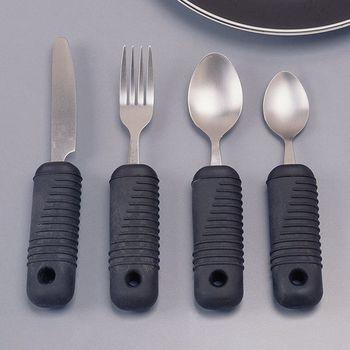 Weighted adaptive flatware set with thick ribbed black foam handles, including knife, fork, and two spoons