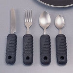 Sure grip adaptive flatware set with four ribbed black foam handles: knife, fork, and two spoons