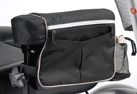 Power mobility armrest bag in black nylon with zippered top compartment, front pockets, and side mesh bottle holder attached
