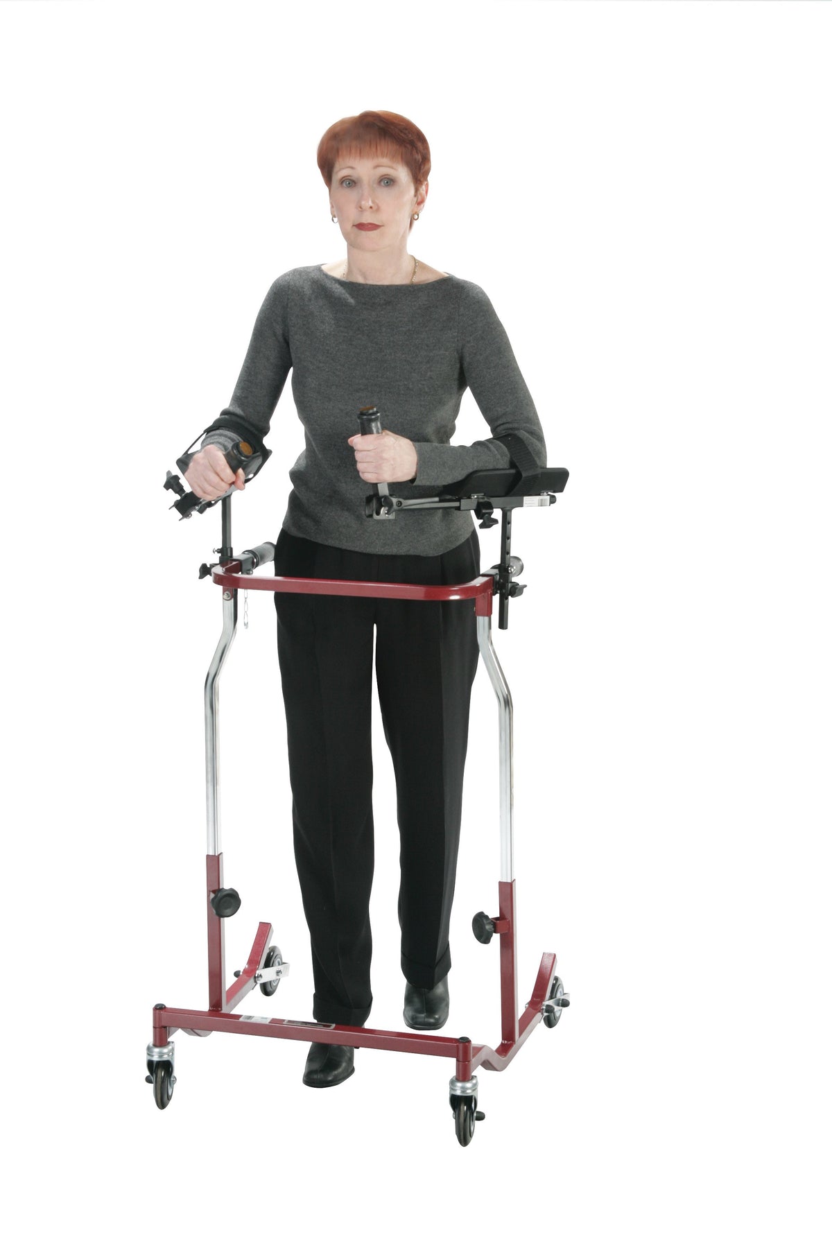 Forearm platform walker attachments shown in use on a red rolling gait trainer, demonstrated by a woman standing inside the
