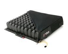 Wheelchair air cushion with black cover, featuring visible air cell chambers along the sides and an inflation valve