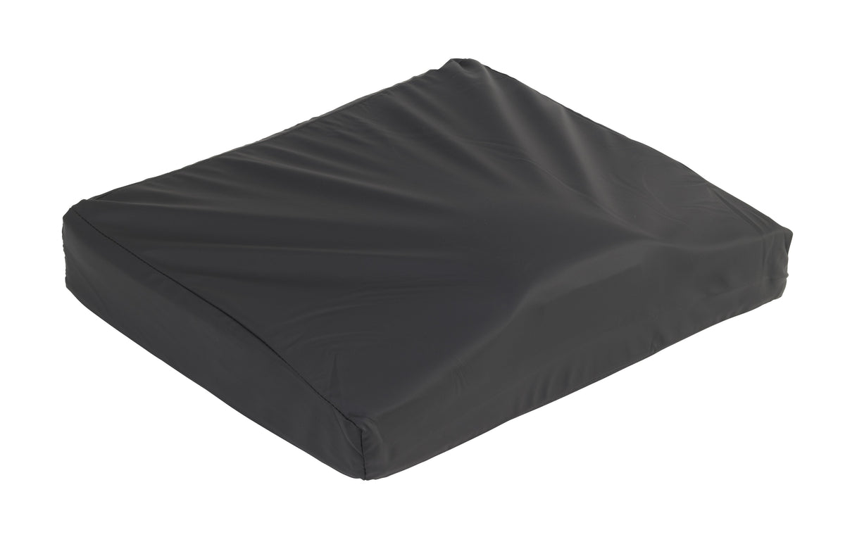 Wheelchair cushion with black vinyl cover, rectangular shape with slight wedge profile, shown on white background