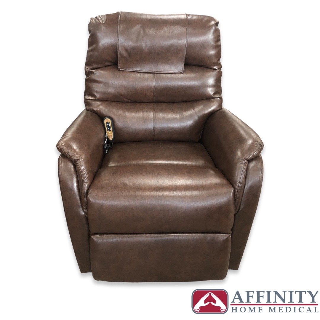 Power lift recliner chair in chestnut brown vinyl upholstery with side-mounted remote control, shown from front view