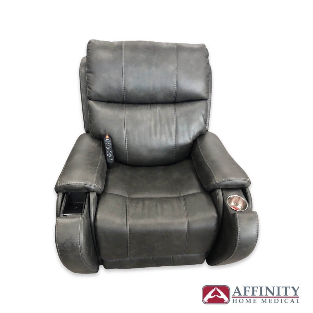 Power lift recliner chair in gray faux leather with side remote control, cup holder, and storage compartment on arms