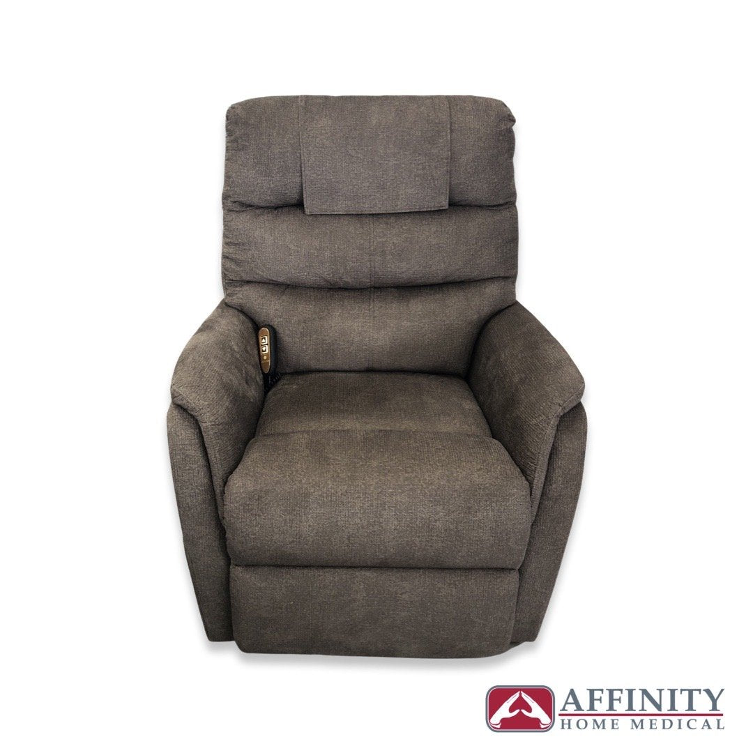 Power lift recliner chair in taupe fabric with tufted back, padded arms, and side-mounted remote control, shown from front