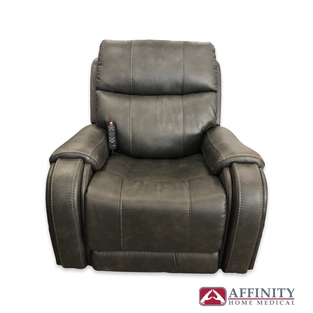 Power lift recliner chair in steel gray suede fabric with padded armrests and side-mounted hand control, front view