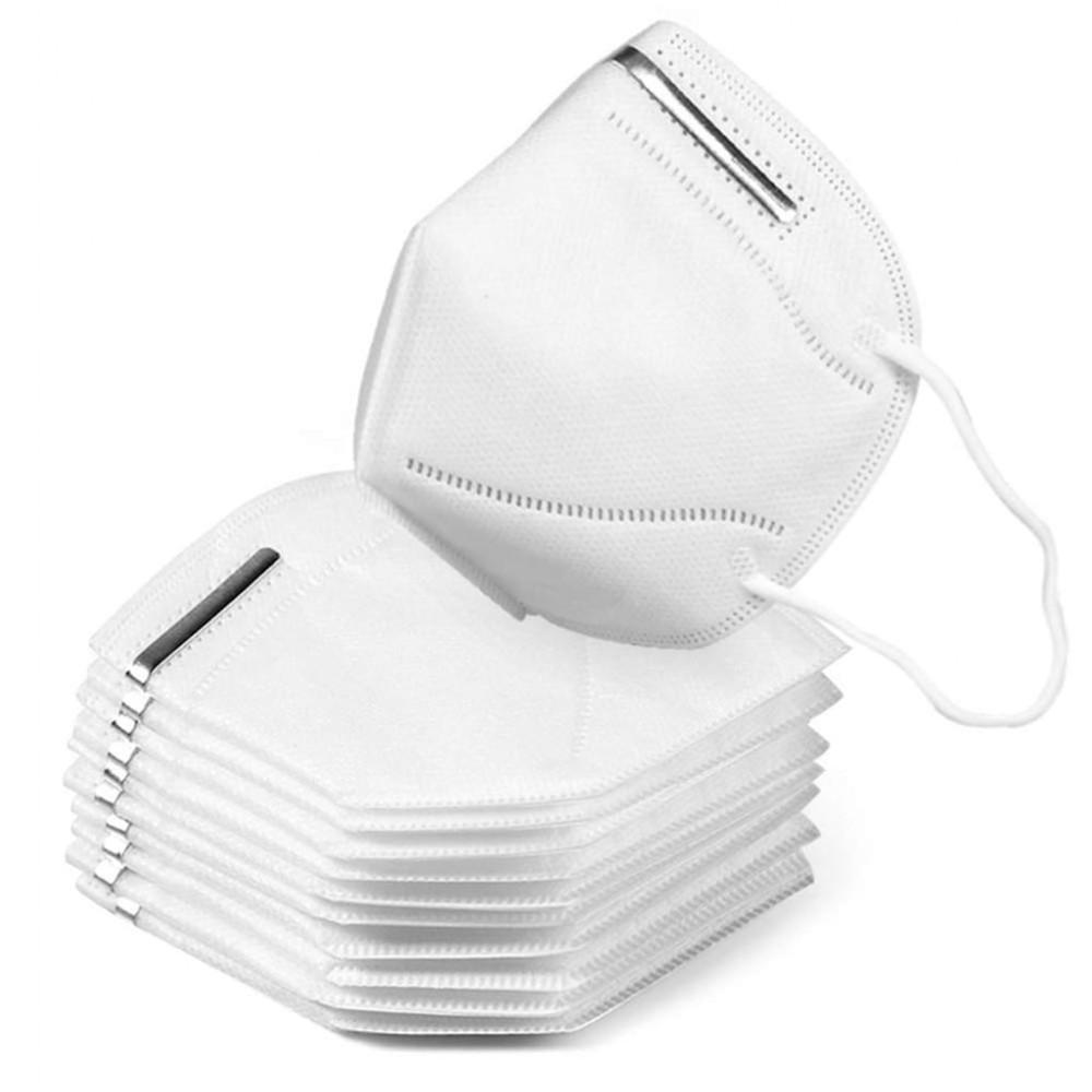 Folded white KN95 face masks stacked in a pile with one open mask displayed upright showing ear loops and nose wire