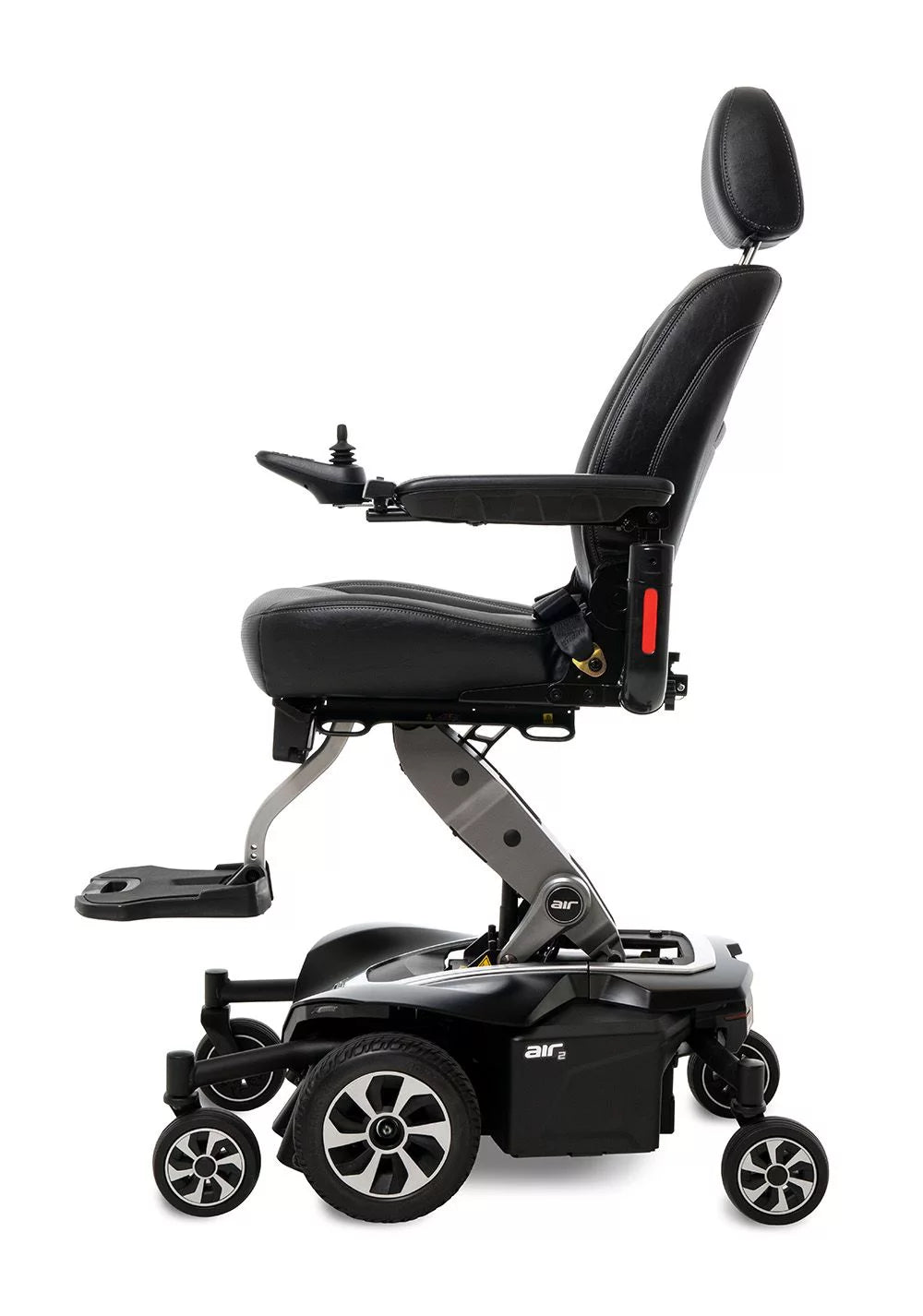 Jazzy Air 2 power wheelchair with black upholstered seat, headrest, joystick control, footrest, and mid-wheel drive base