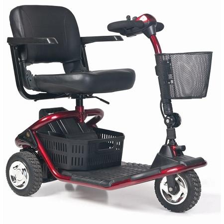 3-wheel mobility scooter in red with black seat, armrests, front wire basket, rear storage basket, and wide tires