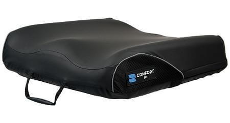 M2 wheelchair cushion with black contoured cover, mesh side panel, carry handle, and blue Comfort logo badge
