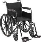 Wheelchair with full arms, black upholstery, and swing-away removable footrests on white background