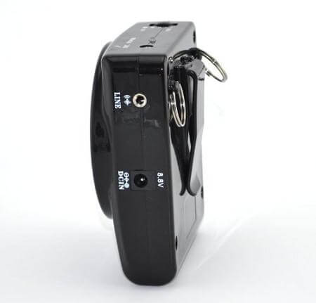Portable pocket voice amplifier side view showing line and power input ports with metal belt clip, black plastic housing
