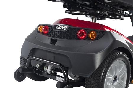 Drive mobility scooter rear view showing tail lights, gray bumper, anti-tip wheels, and red body panel