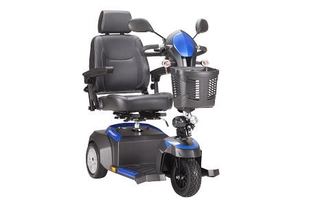 3-wheel power mobility scooter in blue and gray with captain's seat, armrests, tiller, mirrors, and front basket